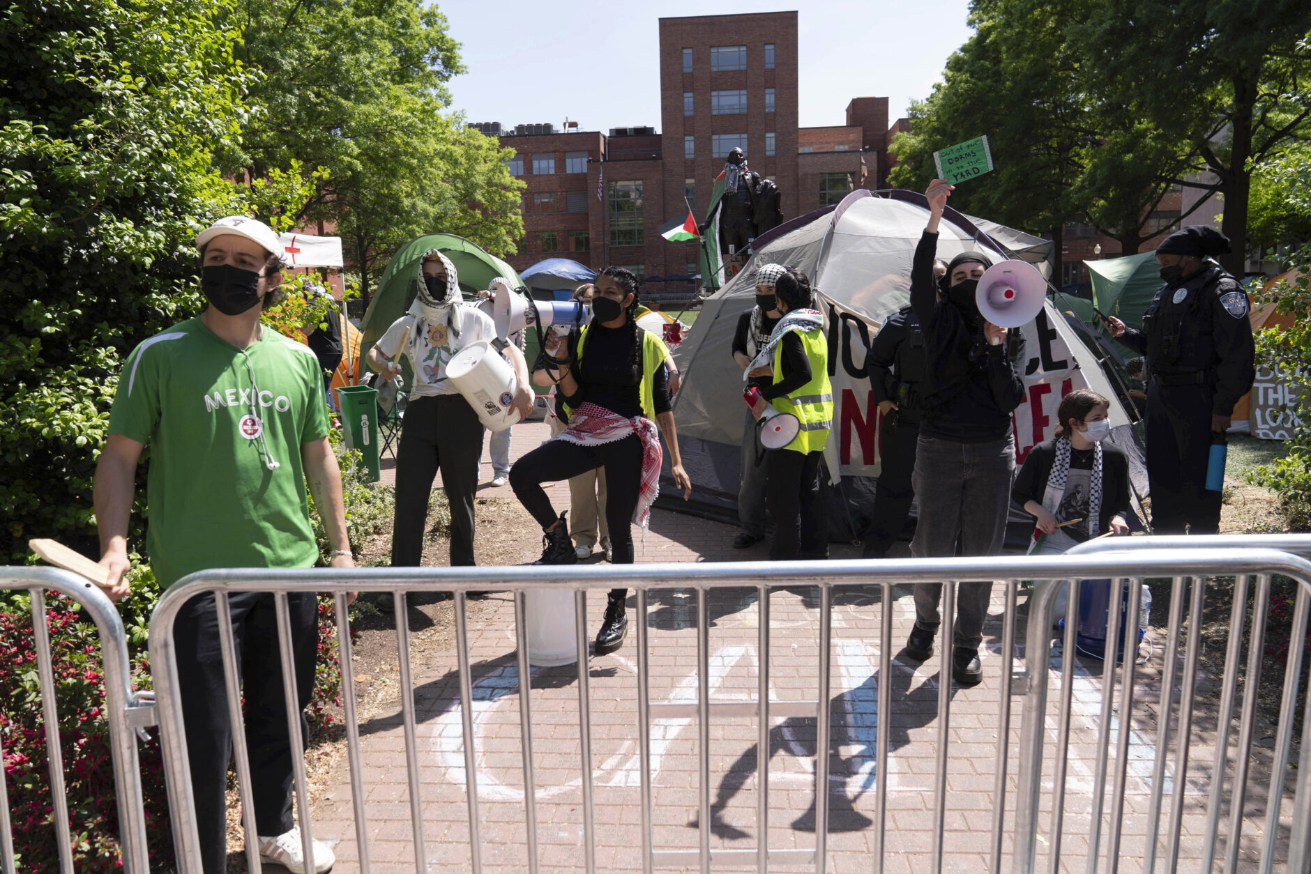 George Washington University students demonstrate on campus after police closed the students encampment during a pro-Palestinian protest over the Israel-Hamas war on Friday, April 26, 2024, in Washington. (AP Photo/Jose Luis Magana)